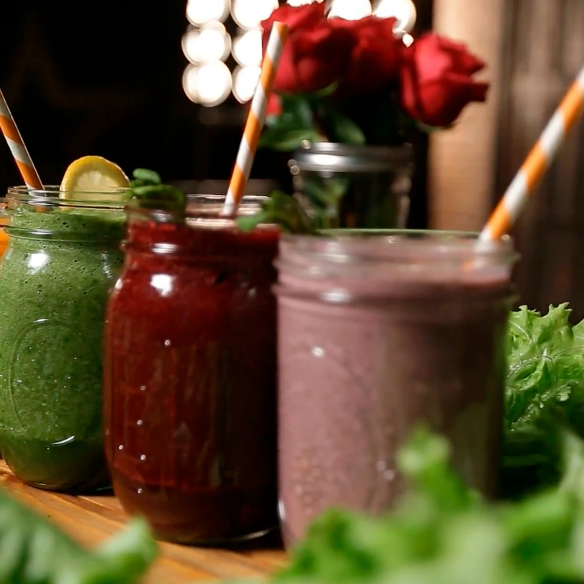 Jars of fresh green, red and berry drinks