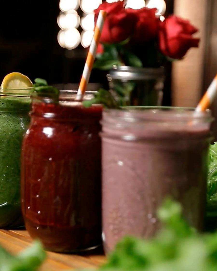 Jars of fresh green, red and berry drinks