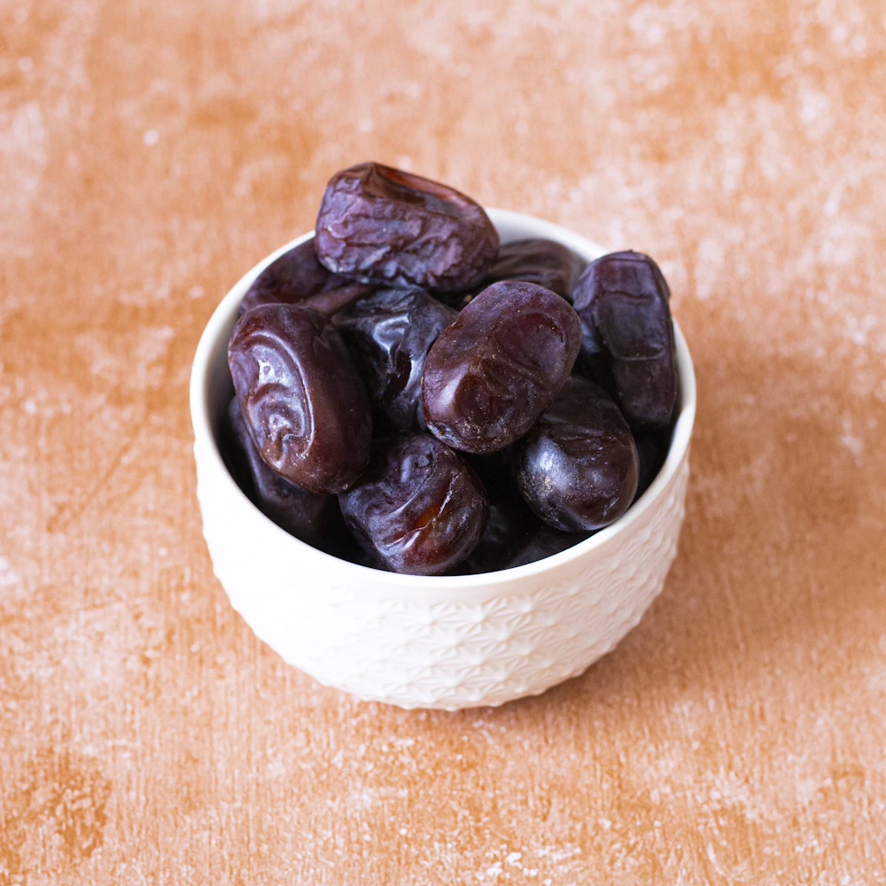 Dates in a white bowl