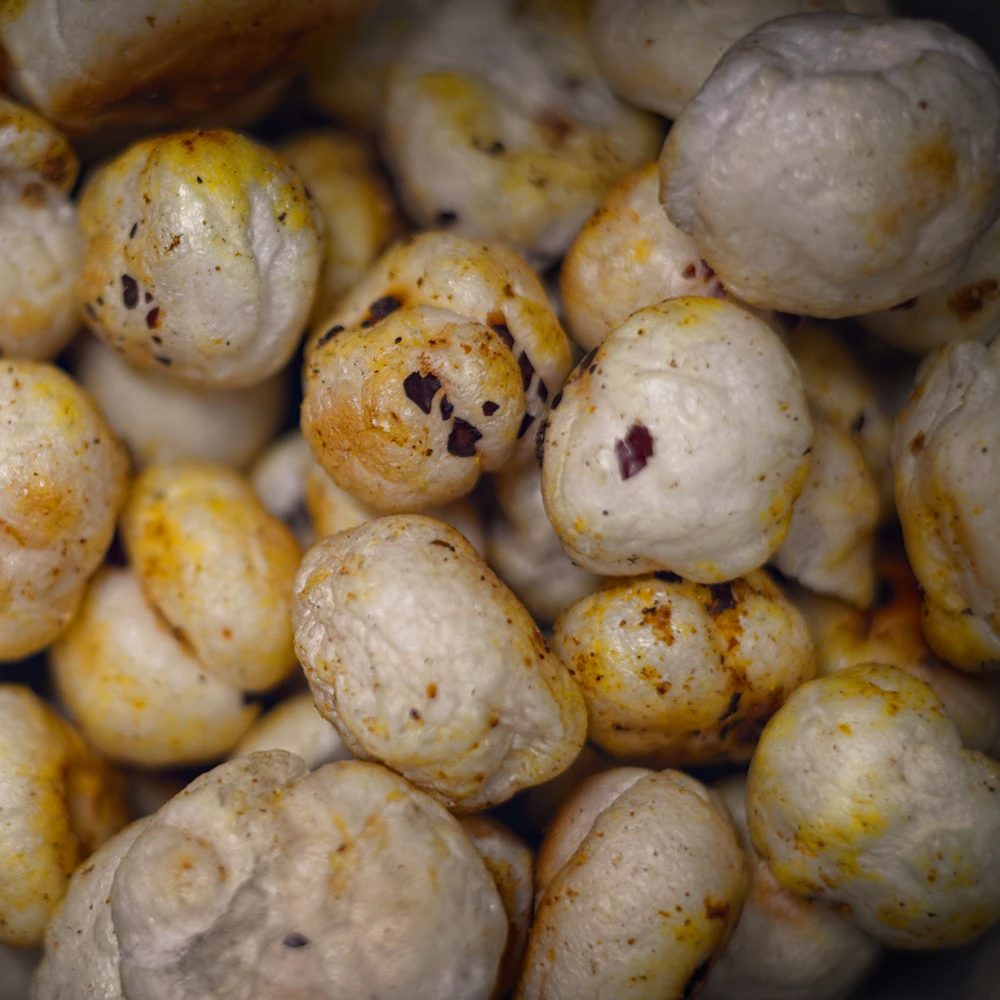 Seasoned makhana with spice flecks