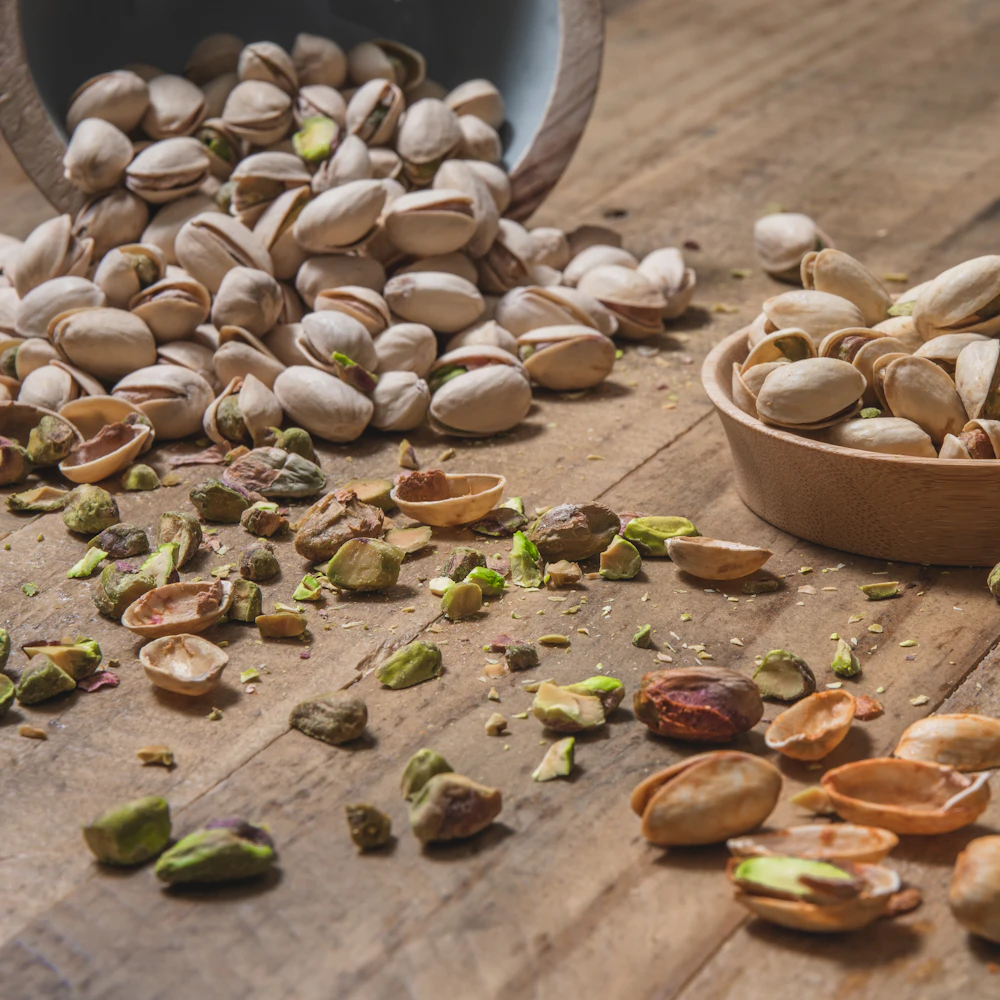 Pistachios on a rustic wooden table