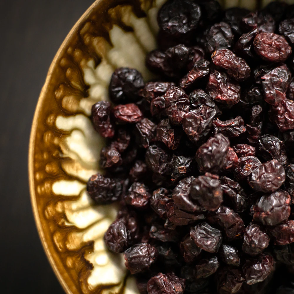 Raisins in a brass bowl